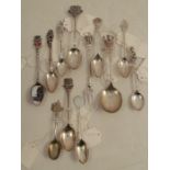 A collection of hallmarked silver souvenir spoons, together with a collection of plated examples and