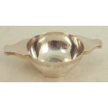 A Scottish silver two handled quaich, with engraved inscription to the rim, Edinburgh 1894, weight