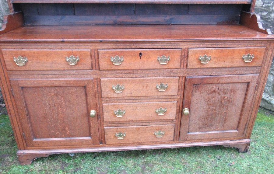 A Georgian cupboard dresser, with an associated close boarded Delft rack over three frieze - Image 5 of 7