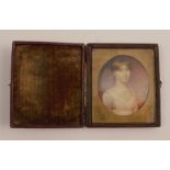 An early 19th century miniature of a young girl, max diameter approx 2ins