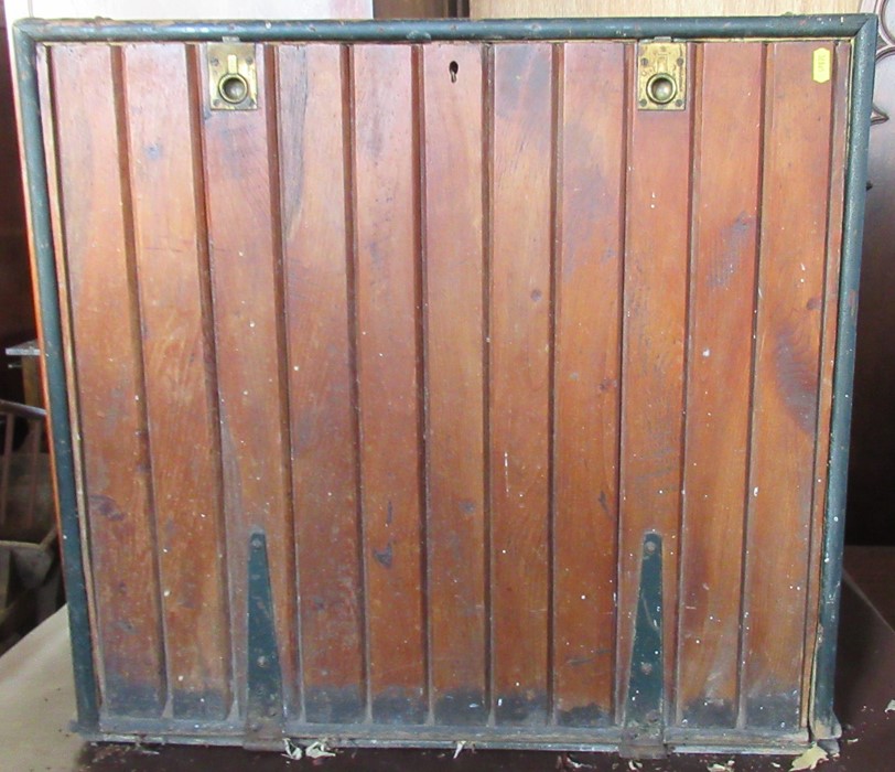 An Antique painted pine estate managers portable desk, with drop flap to the front revealing a