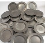 A set of eight Antique pewter plates, with touch marks, diameter 9.25ins, together with a set of