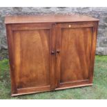 A 19th century mahogany two door press cupboard, with three slide out trays, 43ins x 22ins