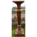 An oak torchere, with spirally turned column, height 43.5ins