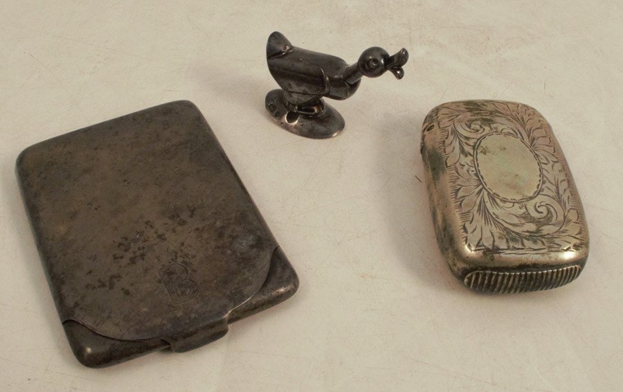 A hallmarked silver match holder, engraved with an initial, together with a model of a duck and a