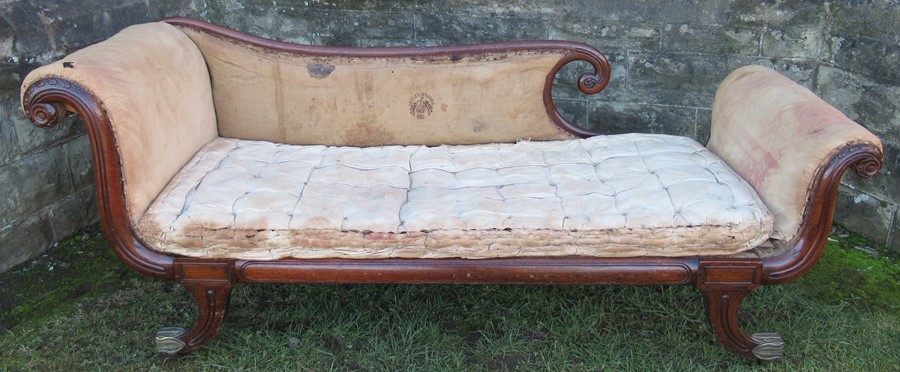 A Regency mahogany framed chaise longue, in the manner of George Bullock,  having scroll ends,
