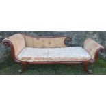 A Regency mahogany framed chaise longue, in the manner of George Bullock,  having scroll ends,