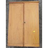 A two door pine wall cupboard, bearing label William Marples & Son, Sheffield, width 18.25in x