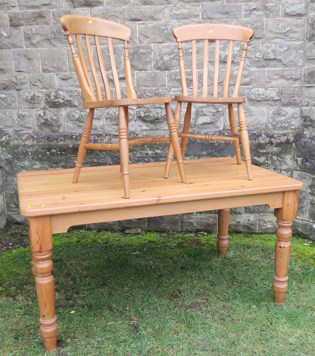 A pine kitchen table, raised on turned legs, having an end drawer, 35ins x 60ins, height 29.5ins,