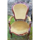 A Victorian show wood grandfather's chair, raised on short cabriole legs