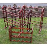 Three modern towel rails, together with a pair of wine racks