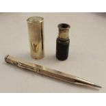 A miniature single drawer telescope, in a brass case with pull off cover, together with a rolled