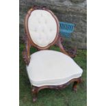 A late Victorian show wood grandfather's chair, with carved short arms, raised on short cabriole