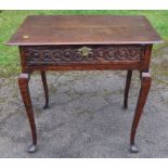 An 18th century oak side table, with later carved drawer front, raised on cabriole legs, 30ins x