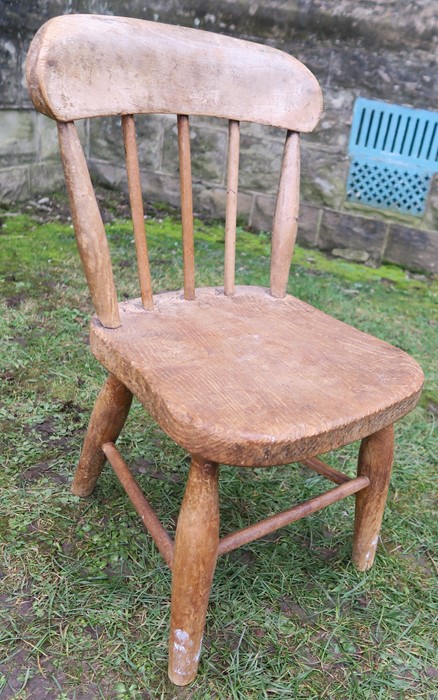 A child's stick back chair