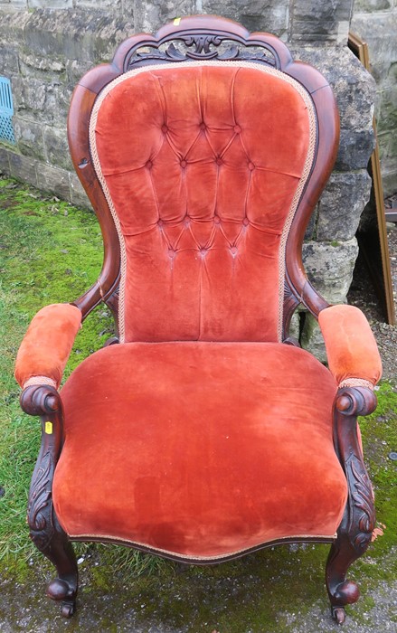 A Victorian mahogany show wood grandfather's chair, raised on short cabriole legs