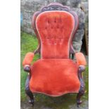 A Victorian mahogany show wood grandfather's chair, raised on short cabriole legs