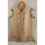 An 18th century embroidered gentleman's waistcoat, the silk front panels embroidered with flowers,