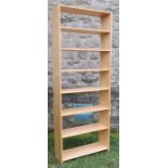 A pine set of shelves, width 40ins x depth 9.5ins x height 78ins