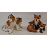 A Royal Worcester model of fox hounds, shape number 3132, circa 1949, height 2.25ins, together