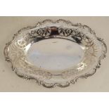 An oval silver pierced dish, with scroll edge, Sheffield 1900, maker William Hutton & Sons Ltd,