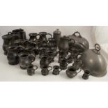 A collection of pewter, to include two meat domes, an Exeter College covered tankard, a jug, pint