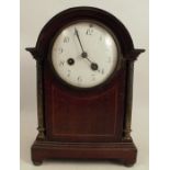 An X.L. Registered mahogany cased mantel clock, with chiming movement, height 10.5ins