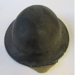 A WW2 helmet, painted black