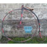 A vintage Penny Farthing, painted in black and red, max height 60ins, front wheel diameter 43ins,