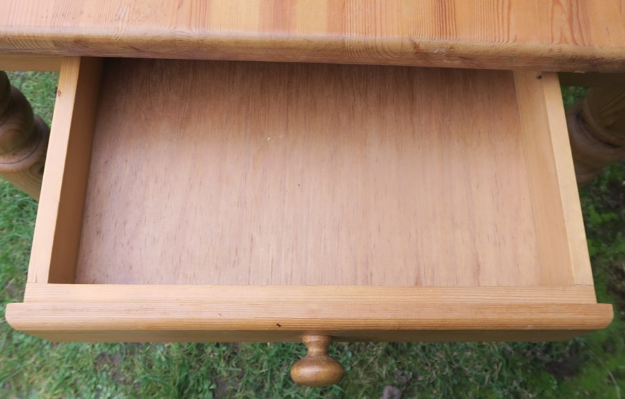 A pine kitchen table, raised on turned legs, having an end drawer, 35ins x 60ins, height 29.5ins, - Image 2 of 2