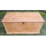 A pine blanket box, with floral papered interior and candle holder, 37ins x 18ins, height 17.5ins