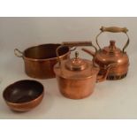 Two copper kettles, together with a copper two handled pan and a circular bowl