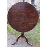 A 19th century oak snap top tripod table, diameter 31ins x height 28ins