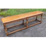 An oak long stool, length 60ins, height 18ins, width 12ins