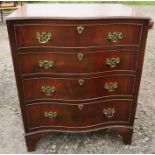 A reproduction mahogany serpentine fronted chest of drawers, having four long graduated drawers,