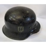 A  black WW2 German style helmet, with an "SS" emblem to one side