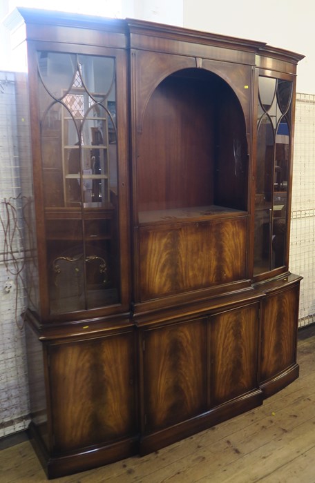 A modern mahogany veneered side unit, with shelves and cupboards