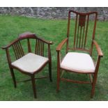 An Edwardian mahogany corner chair, with small marquetry panel to the back, together with another