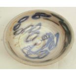 A 20th century studio pottery bowl, with blue decoration to the interior, marked to base, diameter