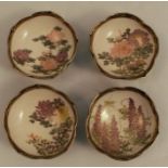 Four Japanese shallow bowls, from the Meiji period, decorated in colours with foliage to a banded