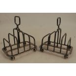 A pair of silver five bar toast racks, of rectangular form with graduated bars, Sheffield 1936,