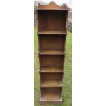 An oak narrow bookcase, height 54ins, width 12ins