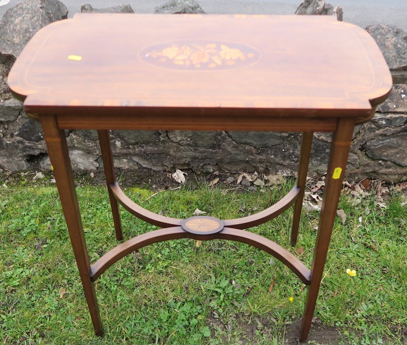 An Edwardian mahogany centre table, of rectangular form, with D shaped ends, having a central