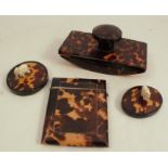 Two tortoiseshell paperweights, together with a blotter and card case, af