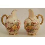 A pair of Royal Worcester blush ivory flat back jugs, decorated with floral sprays, shape number