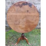 A circular oak tripod occasional table, 30ins x height 27.5ins