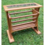A modern oak magazine rack, of rectangular form, possibly Cotswold School by Fred Foster, width 19.