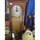 An oak cased electric clock