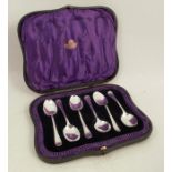 A cased set of six silver teaspoons, with feather edge and engraved with an initial, Sheffield 1915,