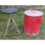 A red painted metal bin, with lid, height including handle 21ins, diameter 15.75ins, together with a